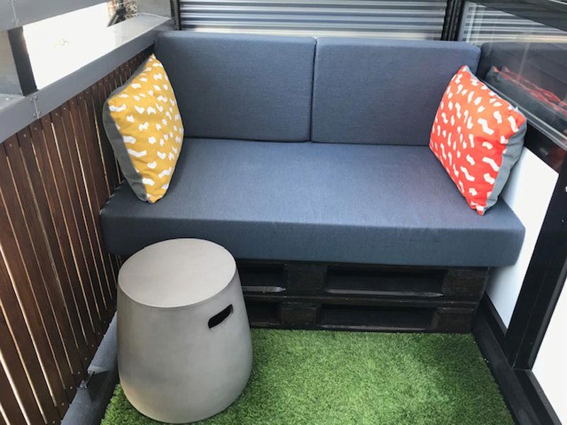 Bespoke Outdoor seat cushions and outdoor scatter cushions for a courtyard garden fixed seating area